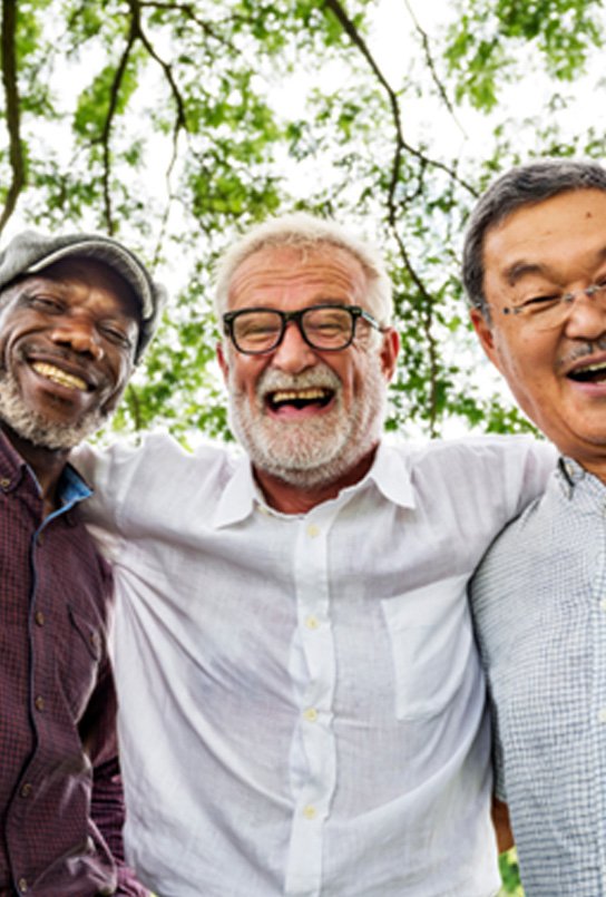 Denture patients in Sumner smiling with friends