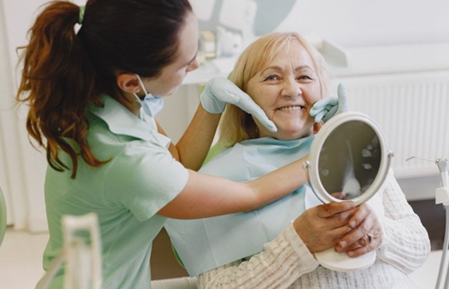 Patient in Sumner talking to dentist about dentures
