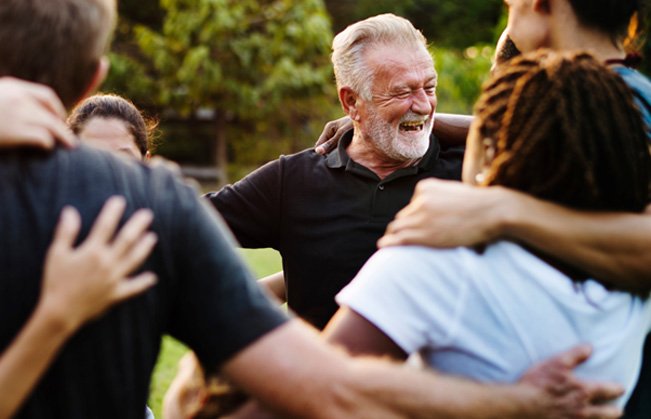 Dentures patient in Sumner smiling with friends